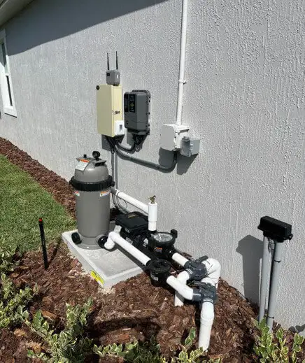 Pool filtration and heating apparatus beside a home's exterior